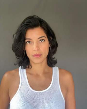 A portrait of bare-faced Stephanie Sigman.